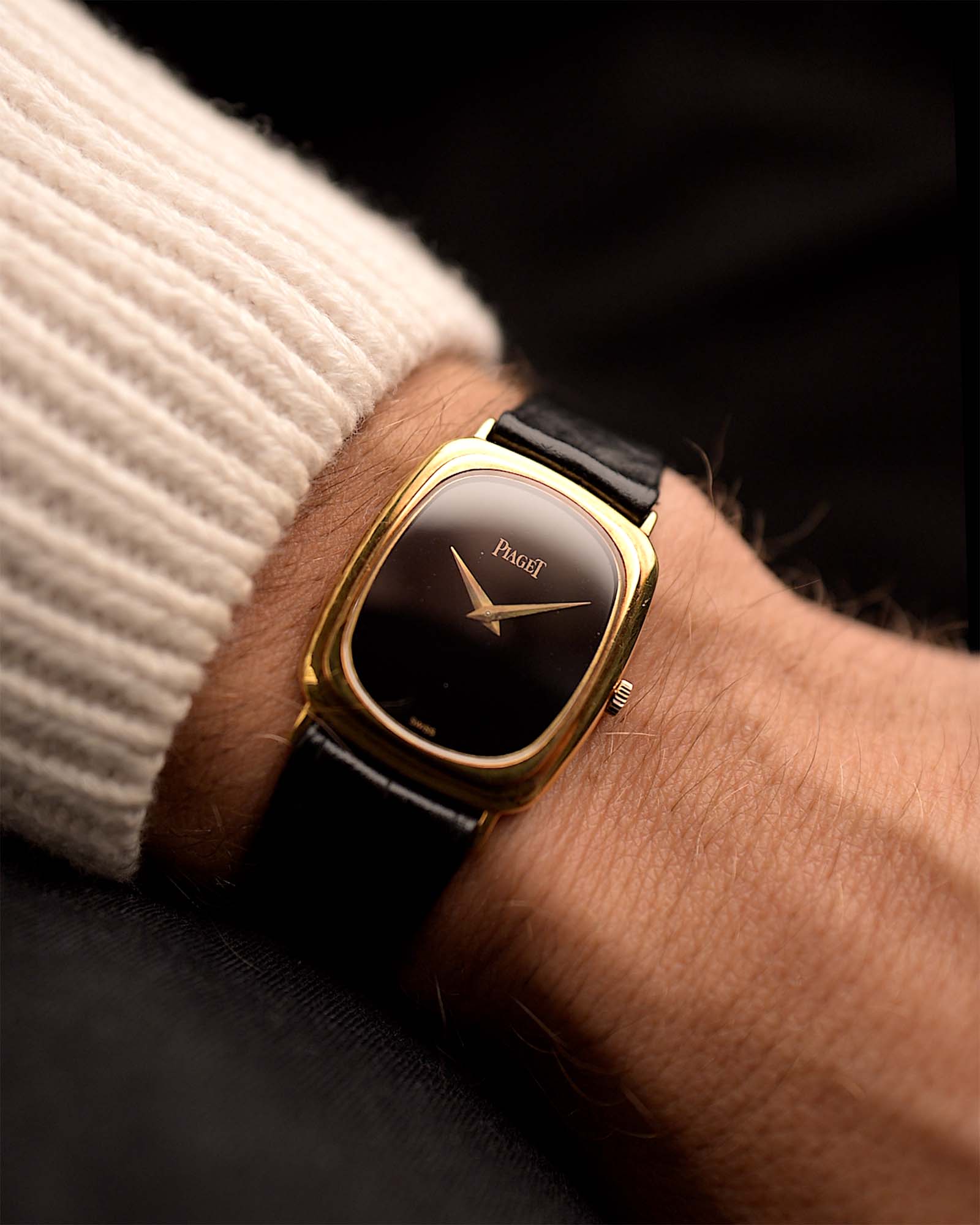 Vintage Piaget Tonneau Watch 9251 Onyx from the 1970s on a wrist. 26mm with 18k yellow gold case, Manual wind Caliber 9P, Flawless onyx dial and Original leather strap.