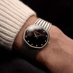 Photo of a Audemars Piguet Octagon Black Diamond from the 1970s on a wrist. 31.5mm case in 18k White Gold with Manual Wind Caliber 2003, Black Dial with Diamond Markers ad Adjustable 18k Bracelet.