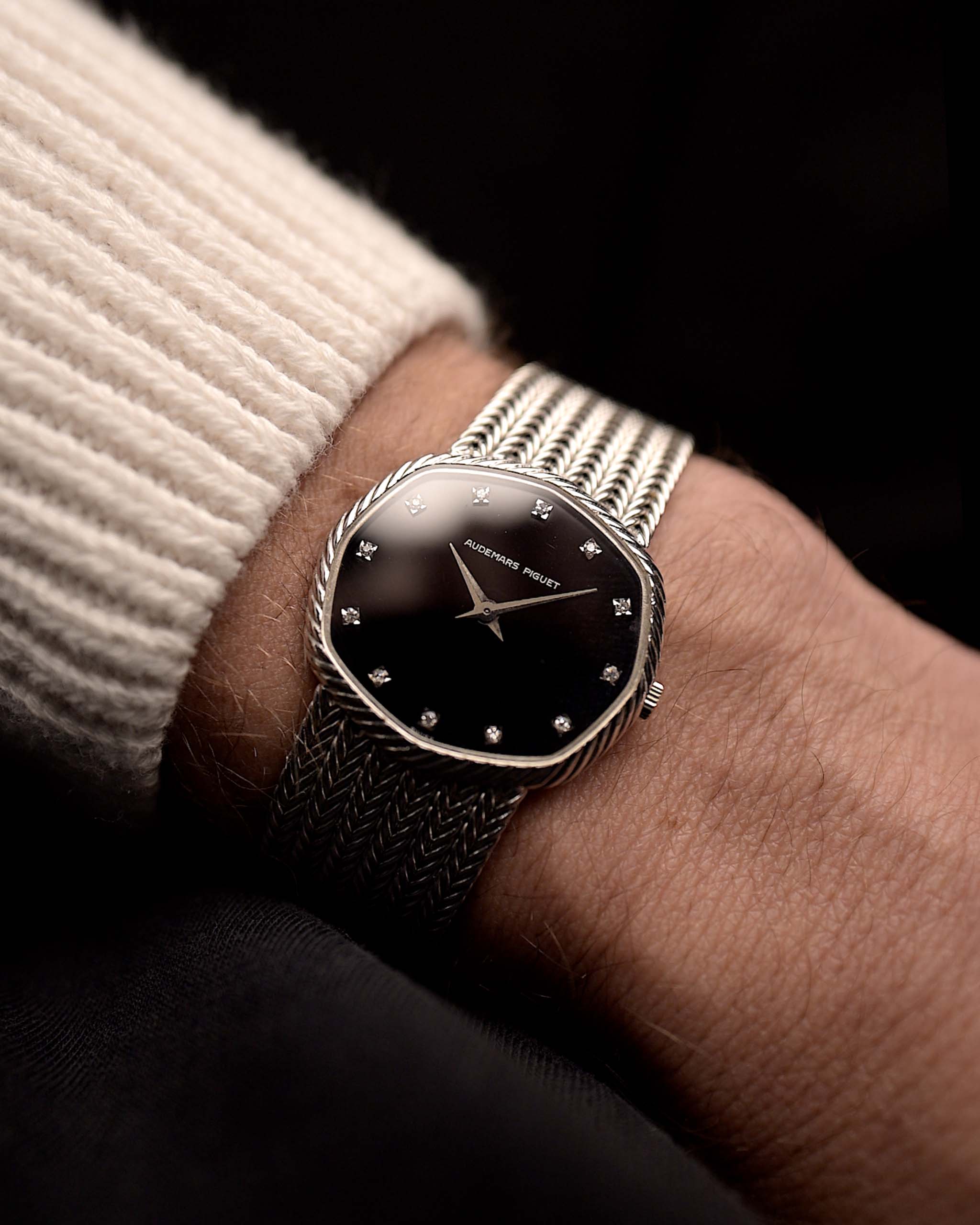 Photo of a Audemars Piguet Octagon Black Diamond from the 1970s on a wrist. 31.5mm case in 18k White Gold with Manual Wind Caliber 2003, Black Dial with Diamond Markers ad Adjustable 18k Bracelet.