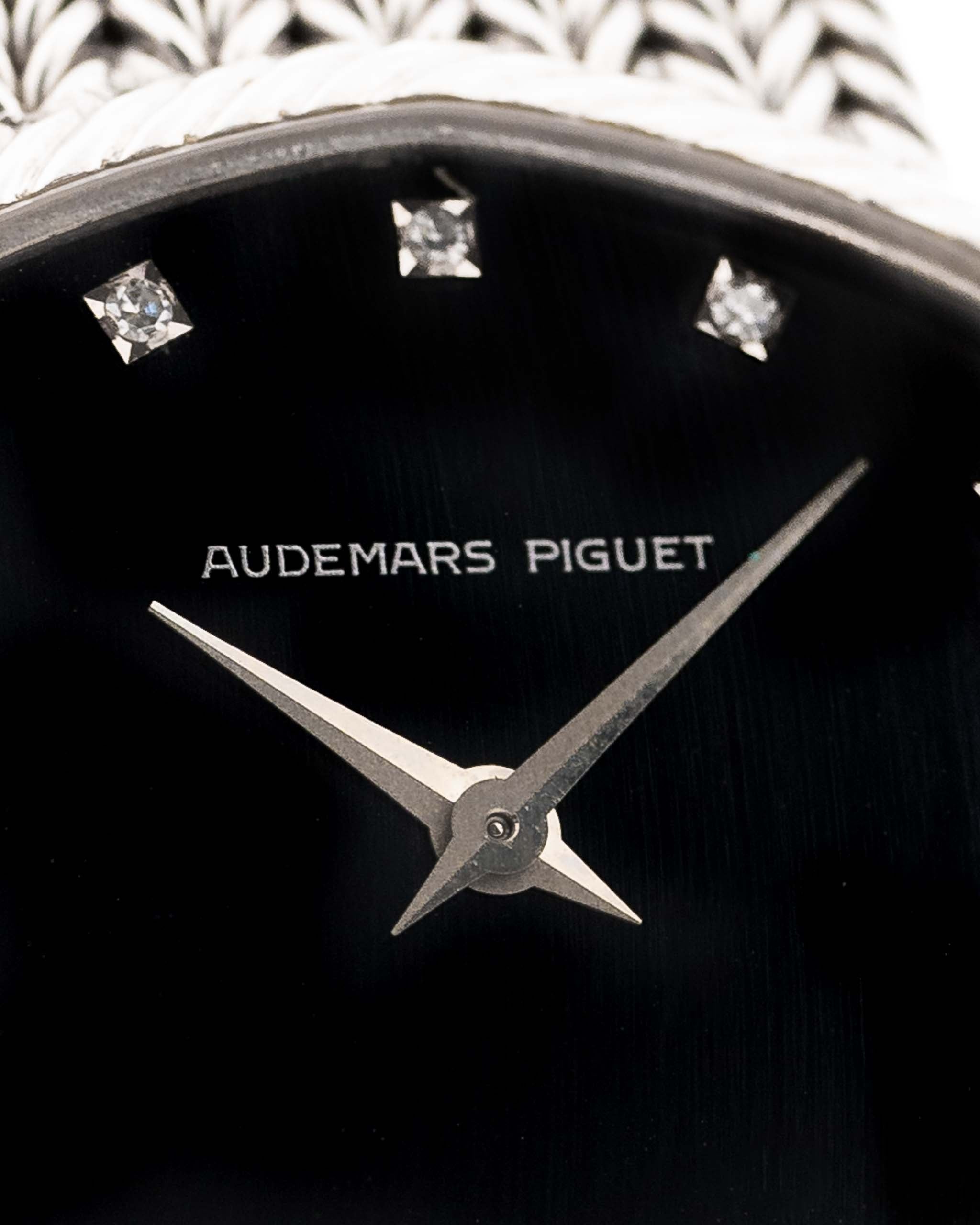 Closeup Photo of a Audemars Piguet Octagon Black Dial Diamond from the 1970s on a wrist. 31.5mm case in 18k White Gold with Manual Wind Caliber 2003, Black Dial with Diamond Markers ad Adjustable 18k Bracelet.
