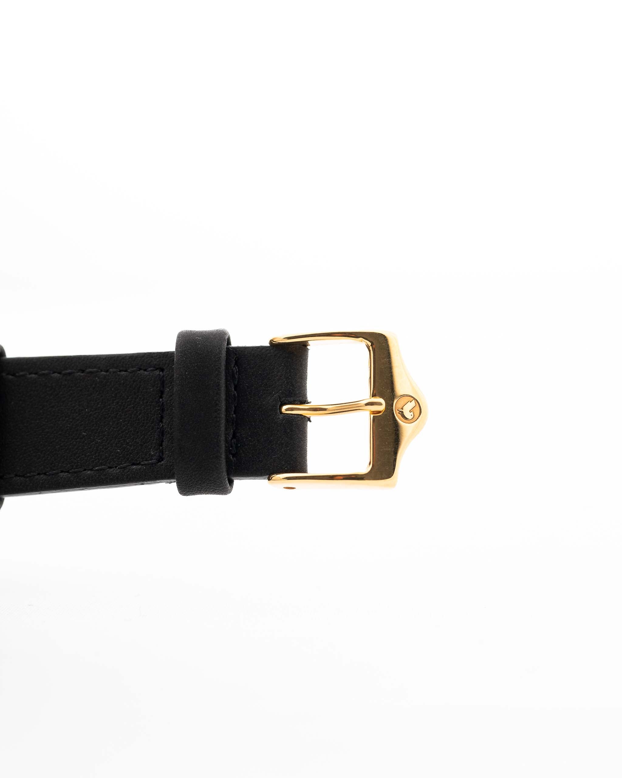 Closeup of a Vintage Cartier Tank Louis 78086 Paris Leather Strap and Buckle from the 1970s. 23x30mm with 18k Yellow Gold Case, Manual Wind Movement, Flawless Ivory Dial.