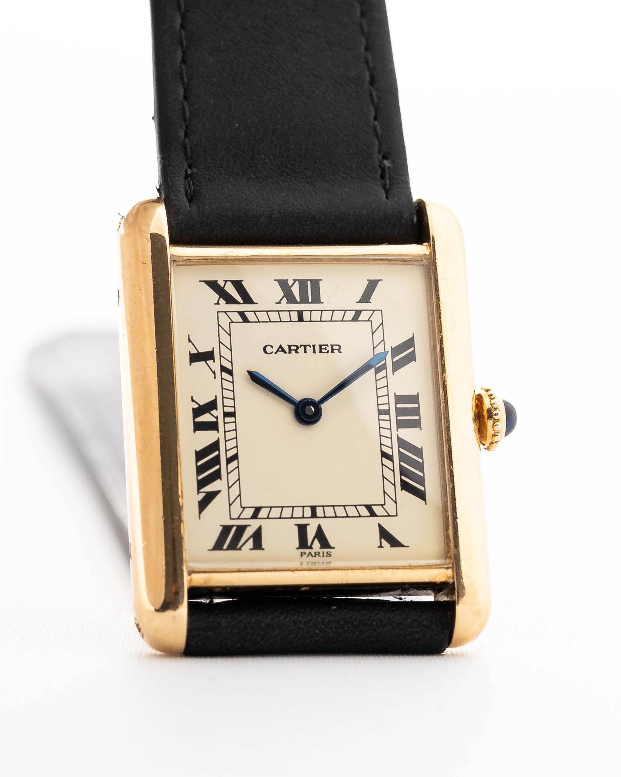 Closeup of a Vintage Cartier Tank Louis 78086 Paris Dial from the 1970s. 23x30mm with 18k Yellow Gold Case, Manual Wind Movement, Flawless Ivory Dial, Hands and Leather Strap.