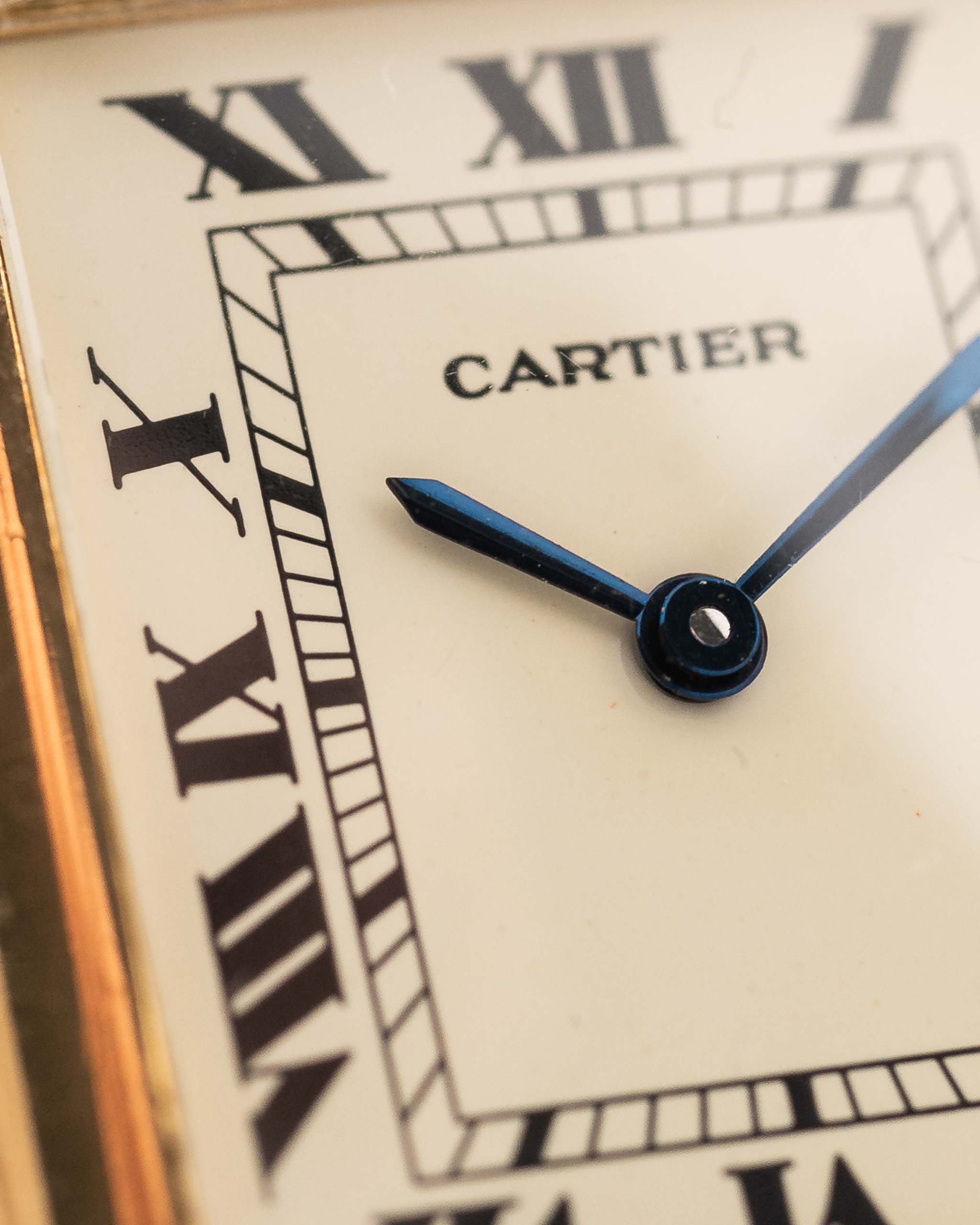 Closeup of a Vintage Cartier Tank Louis 78086 Paris Dial from the 1970s. 23x30mm with 18k Yellow Gold Case, Manual Wind Movement, Flawless Ivory Dial, Hands and Leather Strap.
