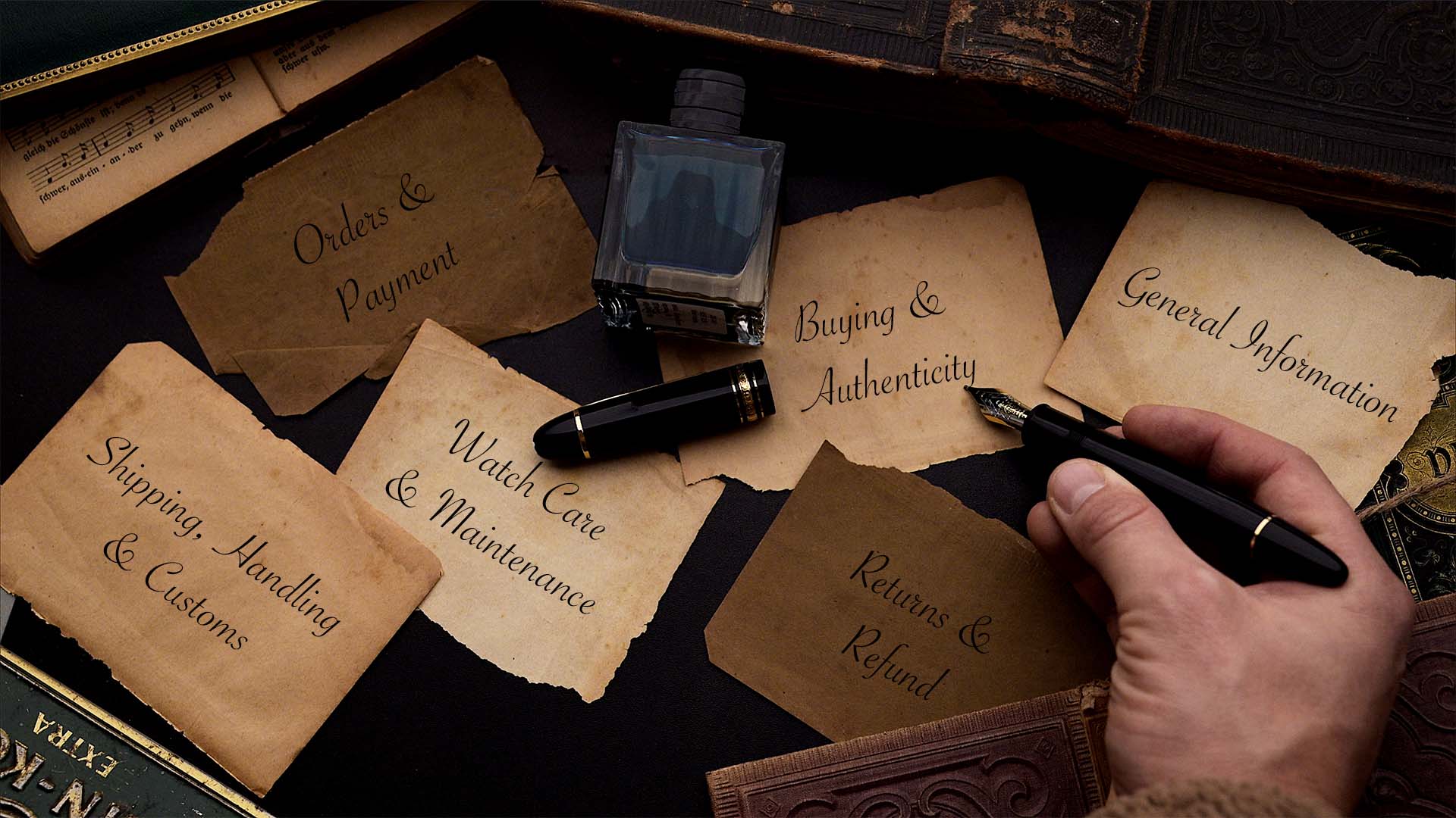 Pen near labeled FAQ cards on a desk.