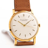 Vintage IWC Cal. 401 Dress Watch R1205 18k from 1964 on a wrist on white background.