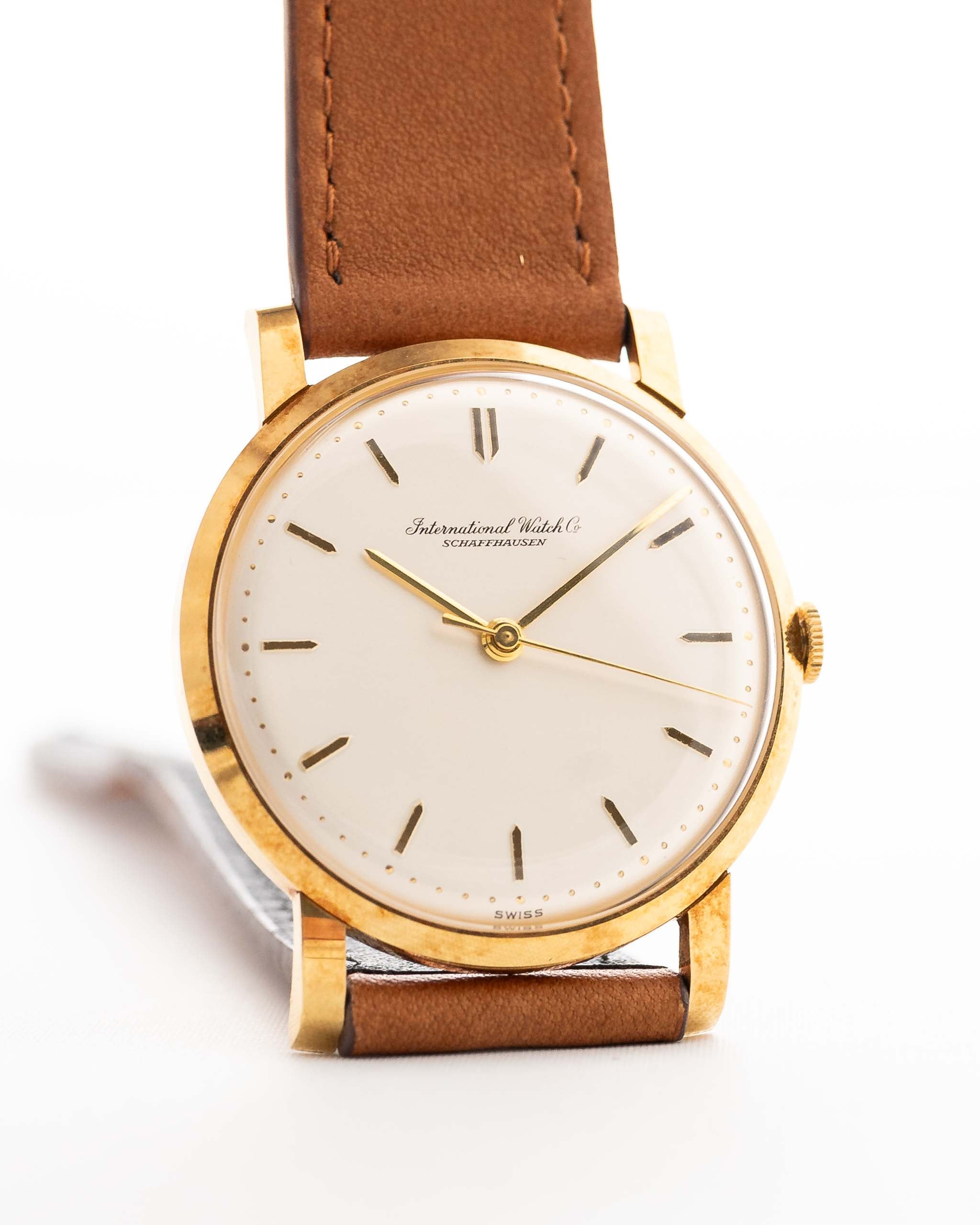 Vintage IWC Cal. 401 Dress Watch R1205 18k from 1964 on a wrist on white background.