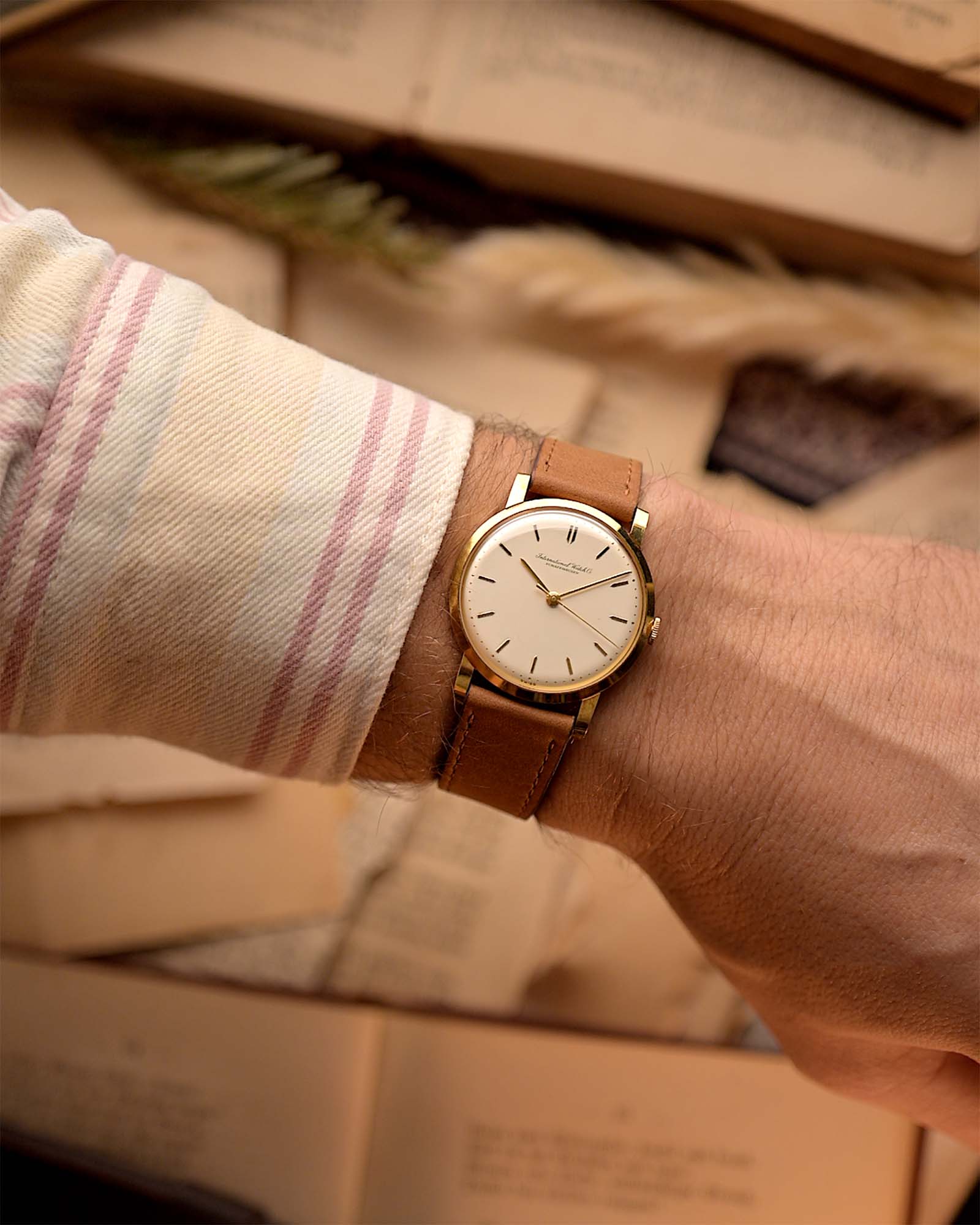 Close-up photo of aVintage IWC Cal. 401 Dress Watch R1205 18k from 1964 on a wrist.