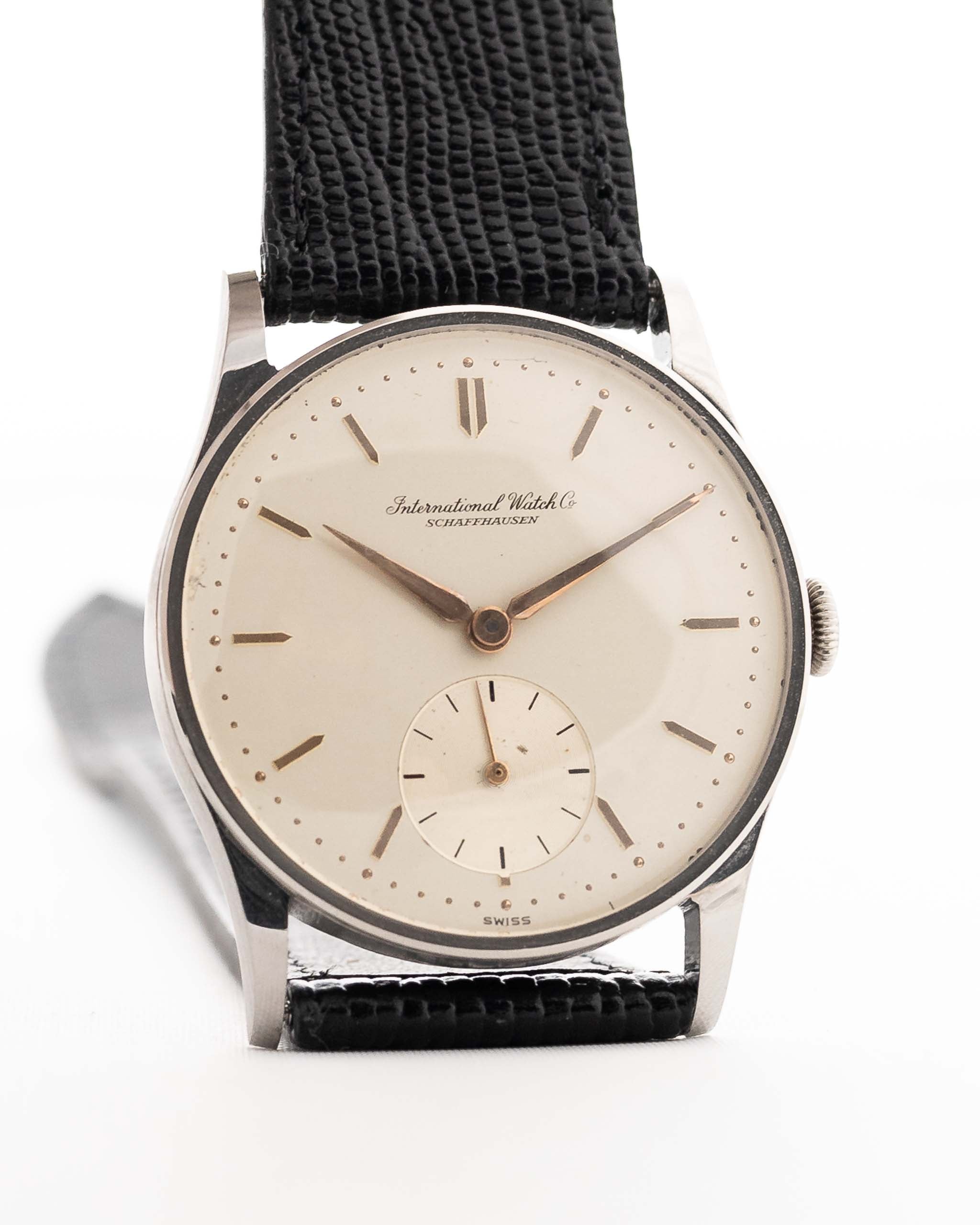 Vintage IWC Cal. 83 Sub Second Watch with a black leather strap against a white background. 32mm wide, Stainless Steel case with Manual Cal. 83 movement, Silver dial and Black Leather Strap.