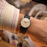 Vintage IWC Cal. 83 Sub Second Watch from 1940 on a wrist with a black leather strap.