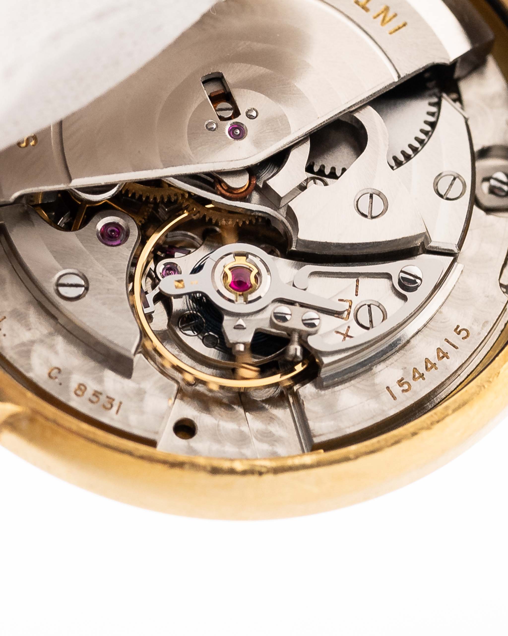 Closeup of a Vintage IWC de Luxe automatic 18k 1959 Movement. 35mm with 18k Yellow Gold Case, Automatic Caliber 8531, flawless Pie Pan Dial and Leather Strap.