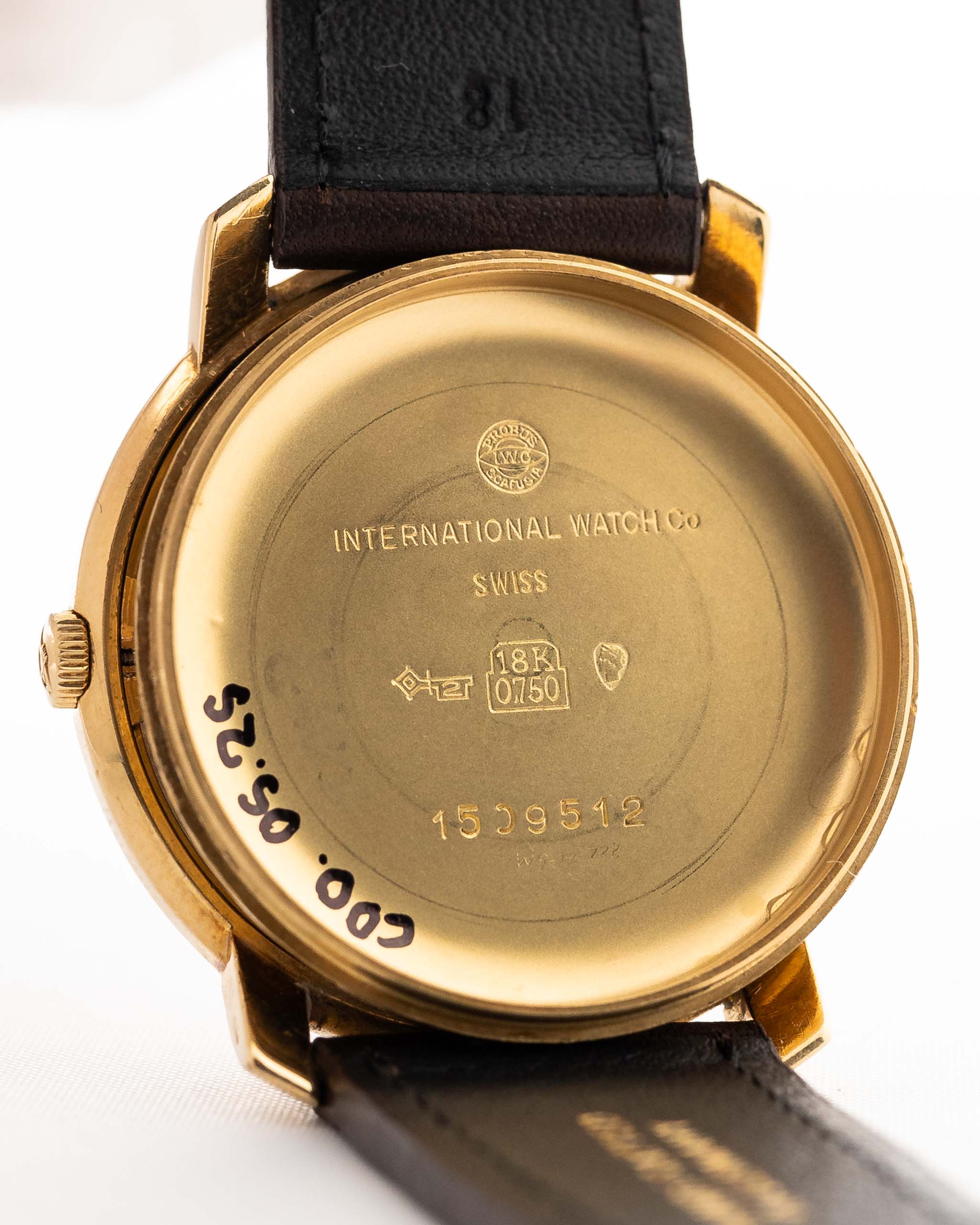 Closeup of a Vintage IWC de Luxe automatic 18k 1959 Case. 35mm with 18k Yellow Gold Case, Automatic Caliber 8531, flawless Pie Pan Dial and Leather Strap.