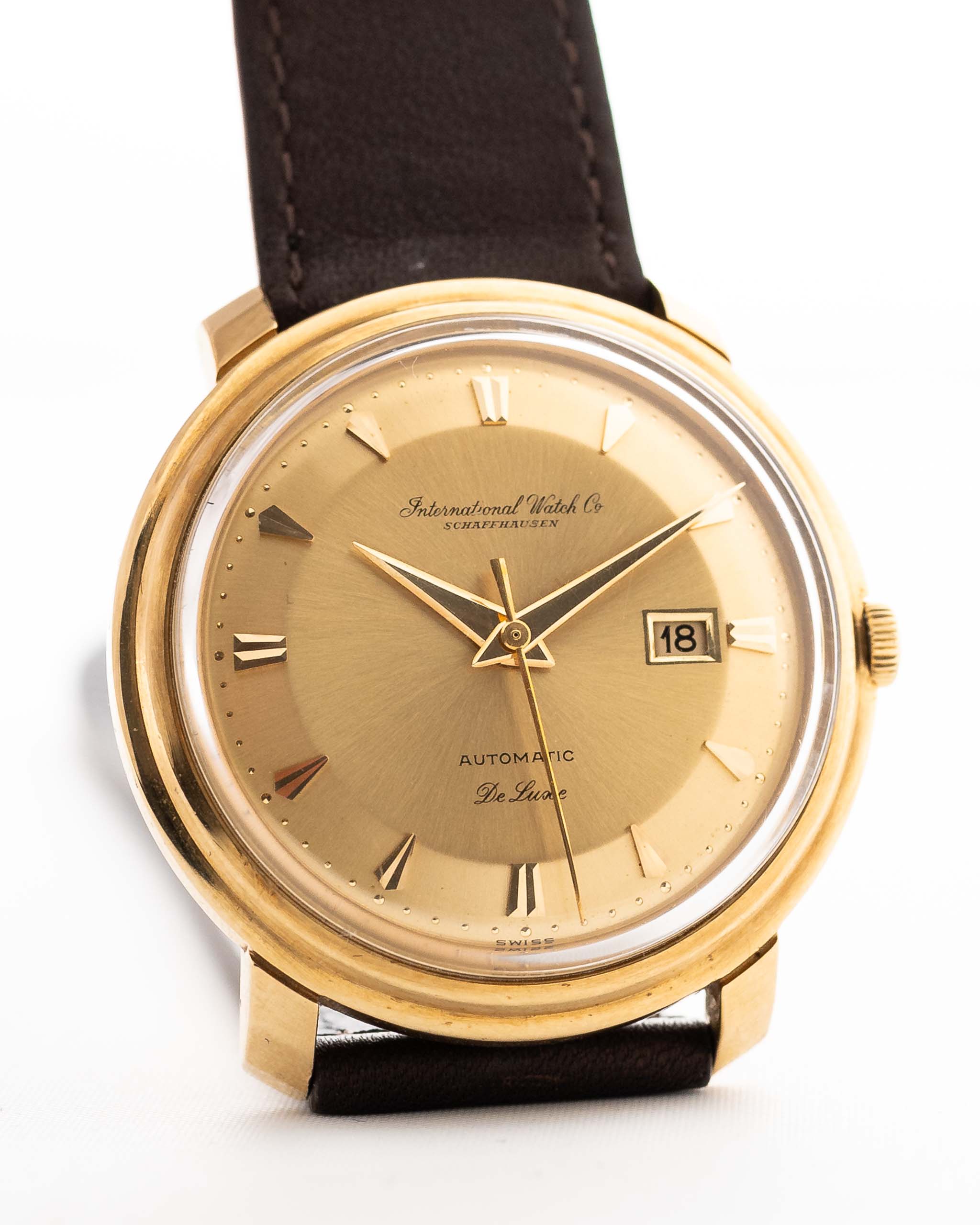 Closeup of a Vintage IWC de Luxe automatic 18k 1959 Dial. 35mm with 18k Yellow Gold Case, Automatic Caliber 8531, flawless Pie Pan Dial and Leather Strap.