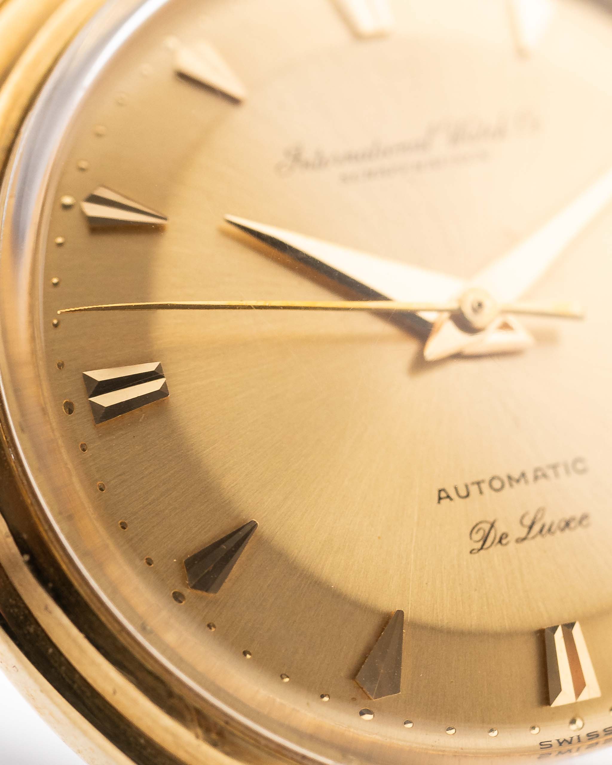 Closeup of a Vintage IWC de Luxe automatic 18k 1959 Dial. 35mm with 18k Yellow Gold Case, Automatic Caliber 8531, flawless Pie Pan Dial and Leather Strap.