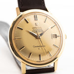 Omega Constellation 168004 Date Onyx 1966 gold dial closeup