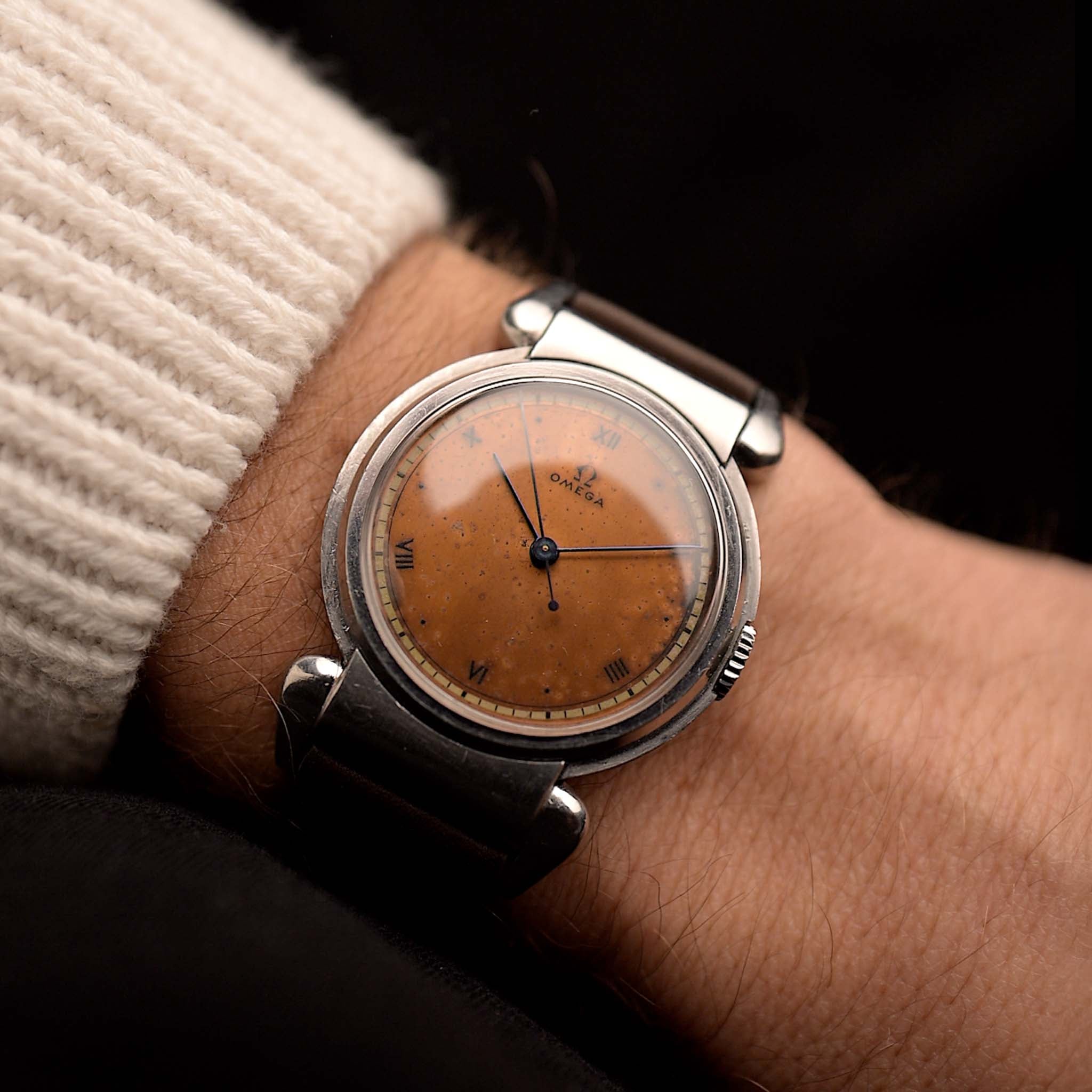 Vintage Omega Big Scarab Copper 1939 watch, 35mm stainless steel case, original copper dial with patina, manual wind movement, leather strap on wrist