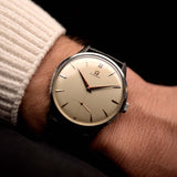 Photo of a Omega Jumbo 2272 Sub Second Steel Rose from 1952 on a wrist. 38mm in Stainless Steel with Manual wind movement, Original champagne dial and Original leather strap.