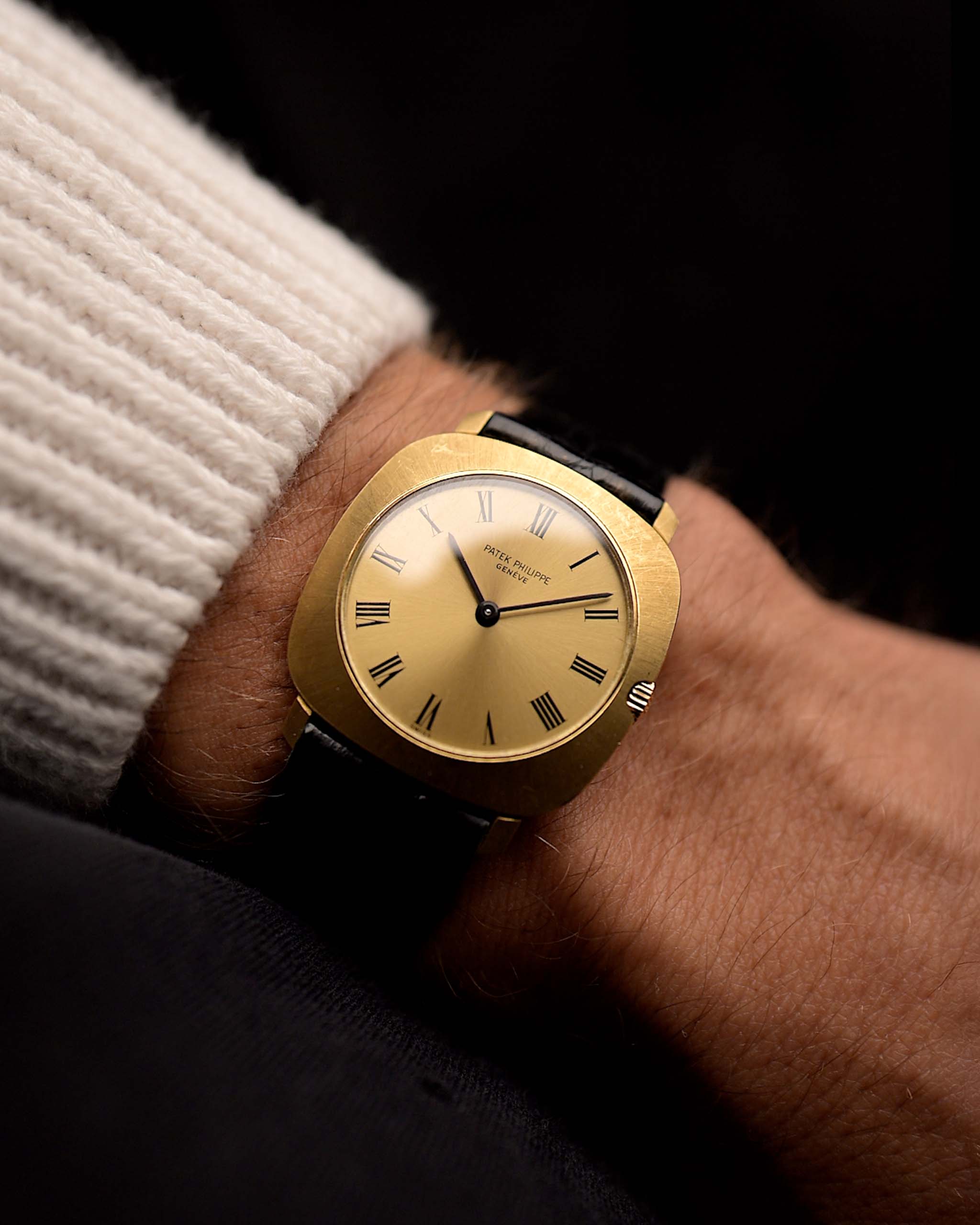 Patek Philippe 3543 Square Roman from the 1970s on a wrist. 31mm in 18k Yellow Gold with Manual wind movement, Golden sunburst dial and Original Leather strap.