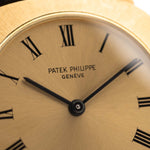 Patek Philippe 3543 Square Roman from the 1970s on a wrist. 31mm in 18k Yellow Gold with Manual wind movement, Golden sunburst dial and Original Leather strap.