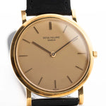 Vintage Patek Philippe 3520 Calatrava Ref. 3520 from the 1960s. 32mm in 18k Yellow Gold with Manual Wind Movement, Original Golden Brushed Dial and Leather Strap.