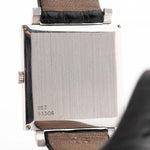 Closeup Photo of a Piaget Protocole 927 18k White Gold from the 1970s. 25mm in 18k White Gold with Manual wind movement, Silver sunburst dial and Original black leather strap.