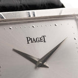 Closeup Photo of a Piaget Protocole 927 18k White Gold from the 1970s. 25mm in 18k White Gold with Manual wind movement, Silver sunburst dial and Original black leather strap.