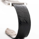 Closeup Photo of a Piaget Protocole 927 18k White Gold from the 1970s. 25mm in 18k White Gold with Manual wind movement, Silver sunburst dial and Original black leather strap.