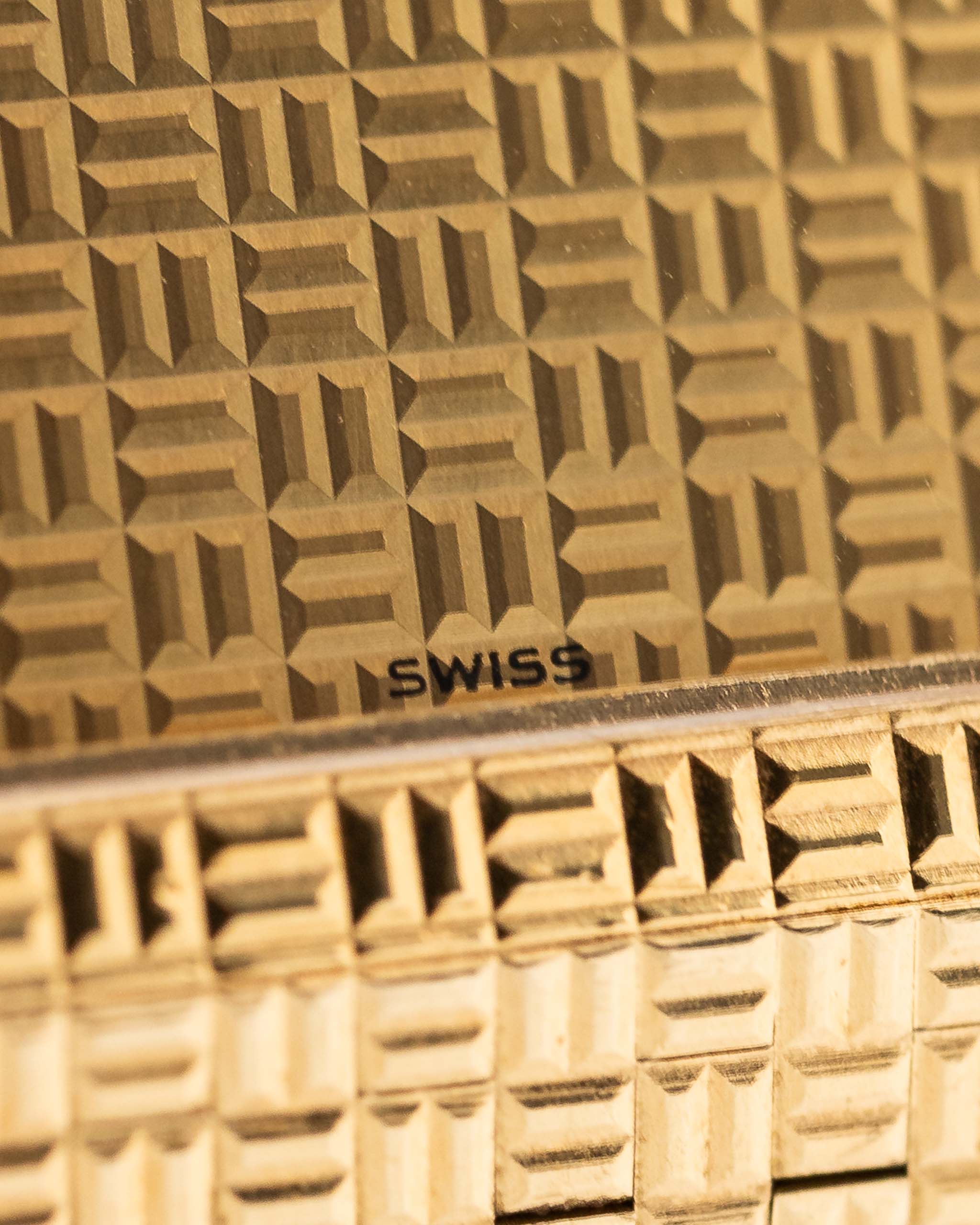 Closeup of Vintage Piaget Polo 7131 C5 Dial. 23mm in 18k Yellow Gold with Guilloche Dial, Integrated 18k Gold Bracelet and Quartz Movement.