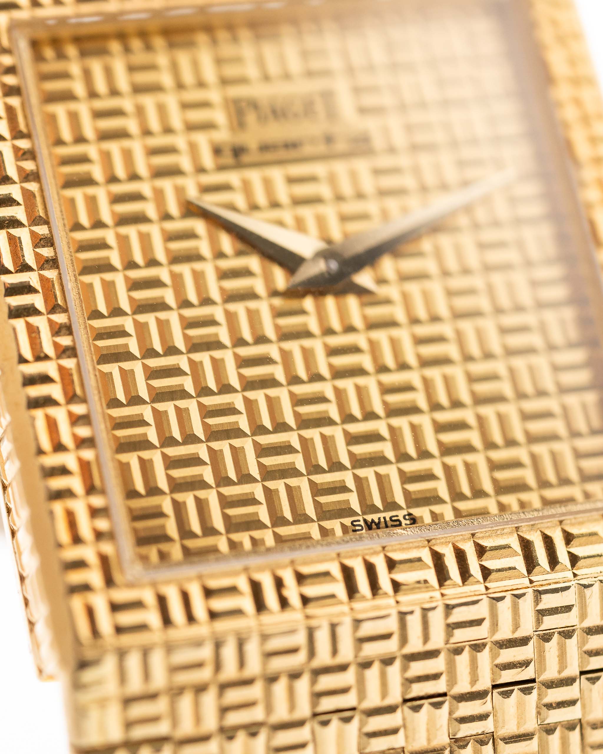 Closeup of Vintage Piaget Polo 7131 C5 Dial. 23mm in 18k Yellow Gold with Guilloche Dial, Integrated 18k Gold Bracelet and Quartz Movement.