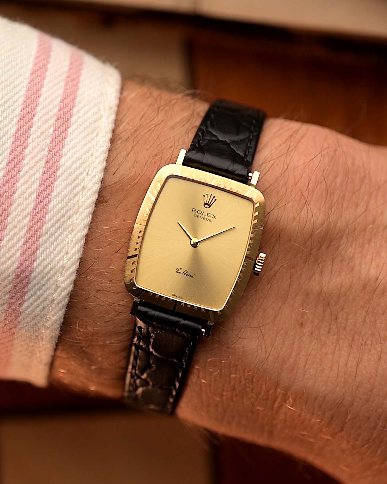 Vintage Rolex Cellini 4080 Rectangular from 1981 on a wrist. 18k Yellow Gold Case with Golden Sunburst Dial.