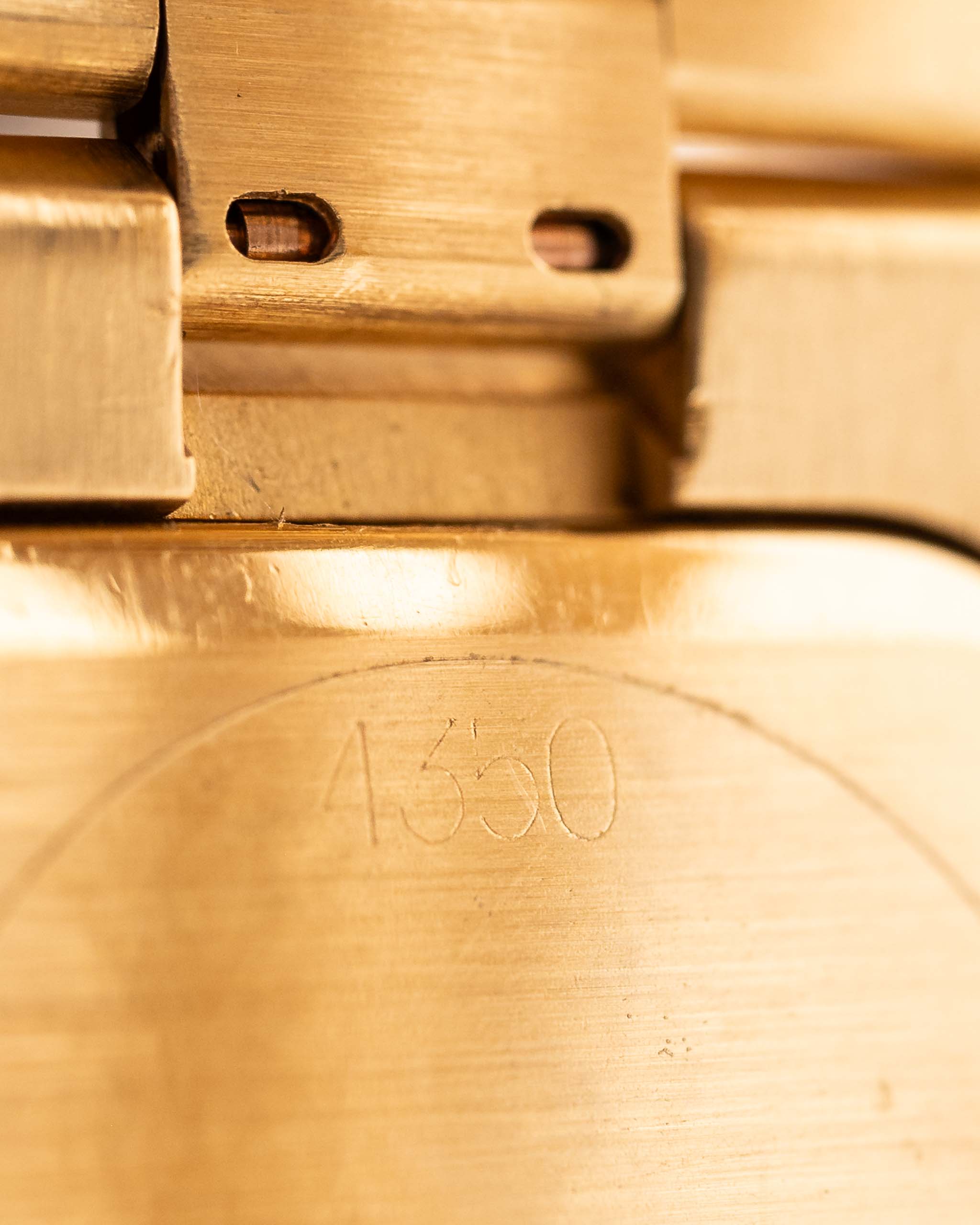 Closeup Photo of a Rolex Cellini 4350 Octagon 18k Silver Dial from 1981 on a wrist. 27mm in 18k Yellow Gold with Manual Wind Movement, Flawless Horizontal Brushed Dial and President Bracelet.