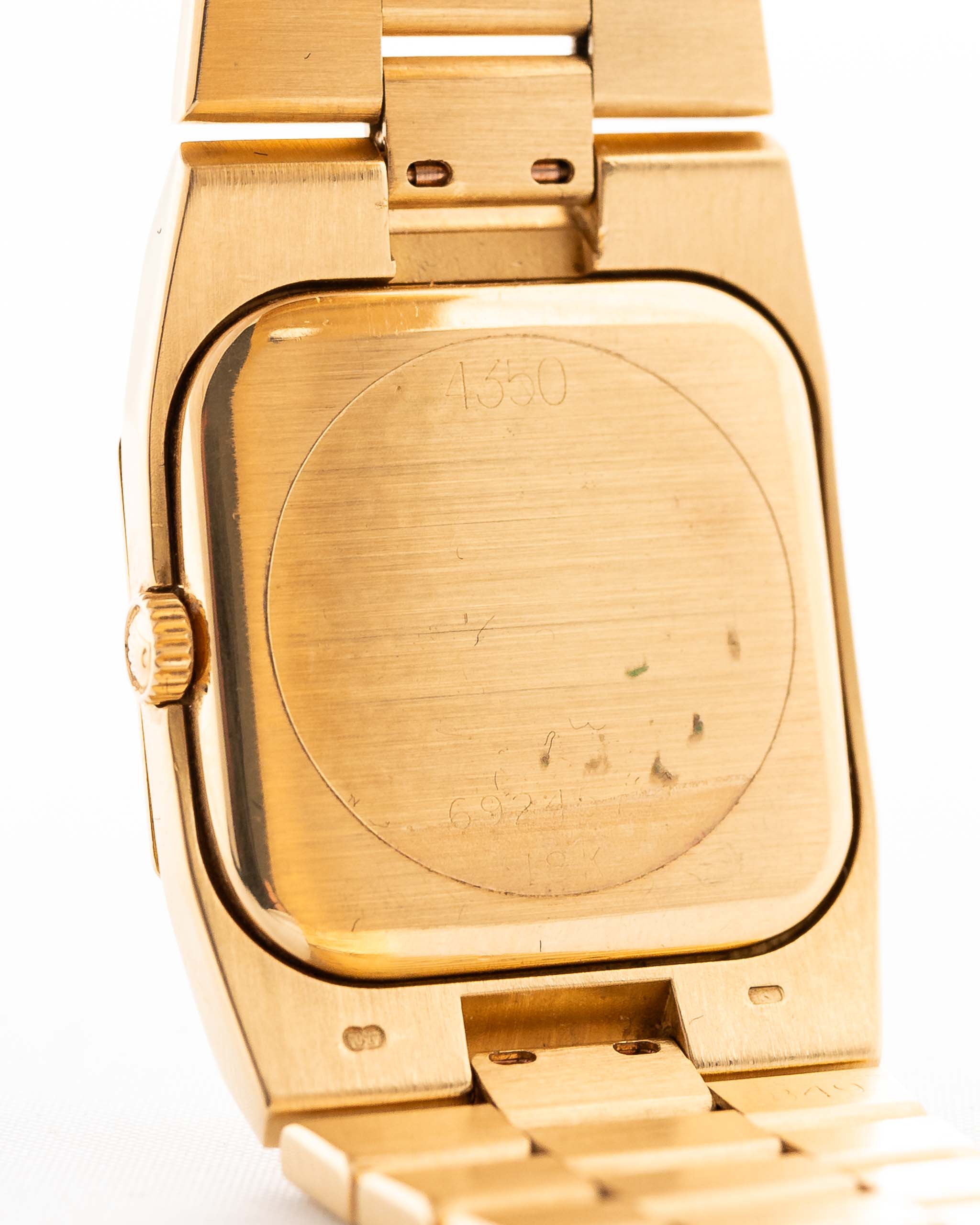 Closeup Photo of a Rolex Cellini 4350 Octagon 18k Silver Dial from 1981 on a wrist. 27mm in 18k Yellow Gold with Manual Wind Movement, Flawless Horizontal Brushed Dial and President Bracelet.