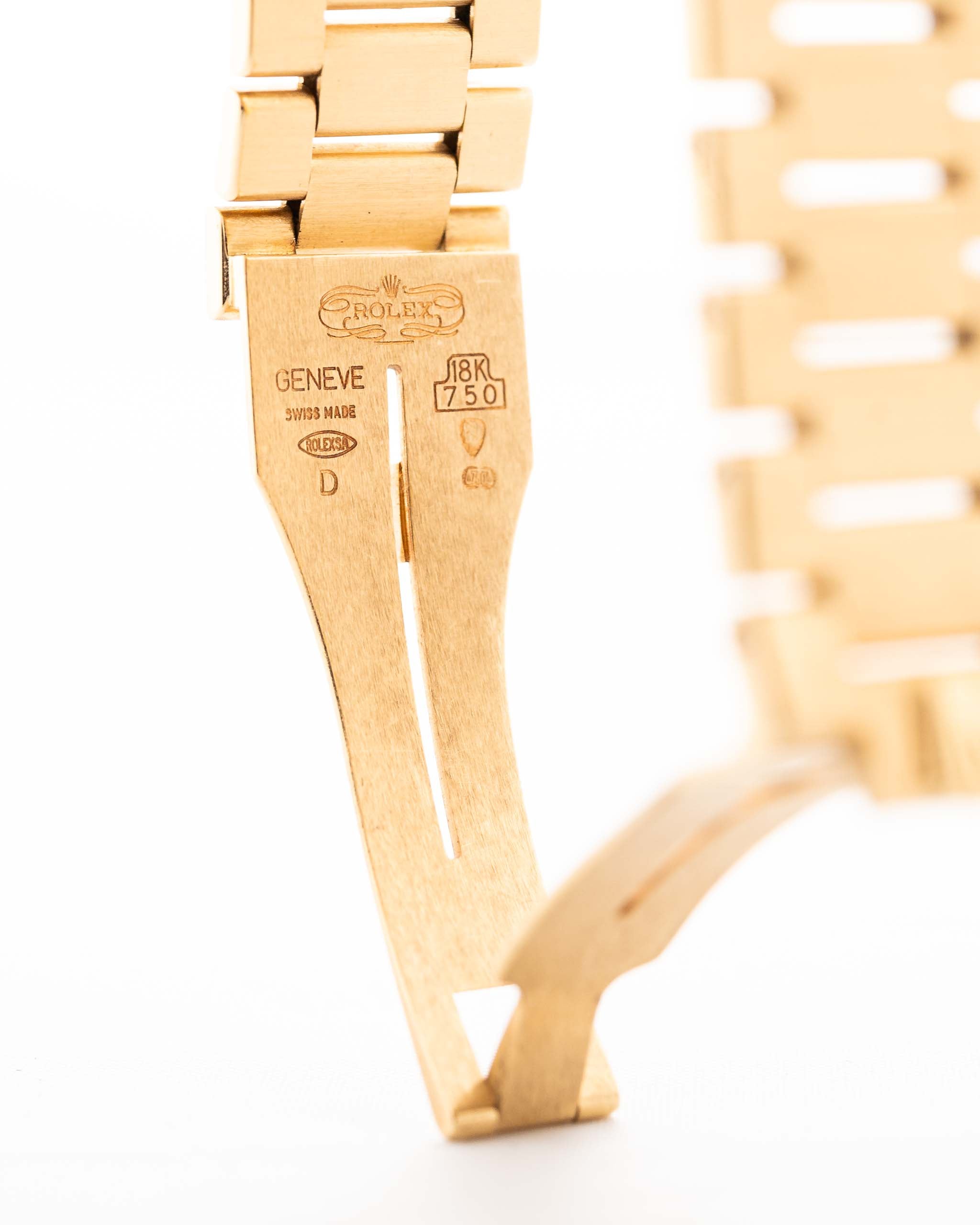 Closeup Photo of a Rolex Cellini 4350 Octagon 18k Silver Dial from 1981 on a wrist. 27mm in 18k Yellow Gold with Manual Wind Movement, Flawless Horizontal Brushed Dial and President Bracelet.