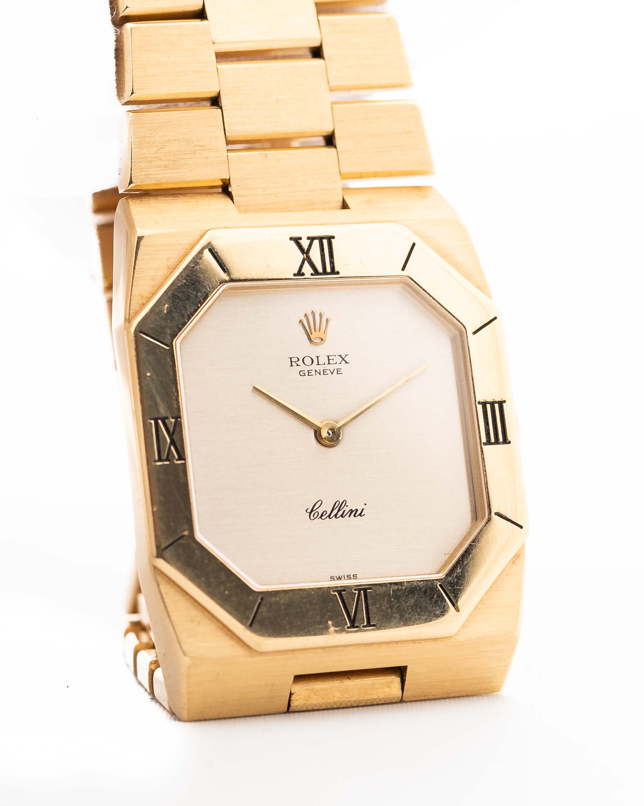 Closeup Photo of a Rolex Cellini 4350 Octagon 18k Silver Dial from 1981 on a wrist. 27mm in 18k Yellow Gold with Manual Wind Movement, Flawless Horizontal Brushed Dial and President Bracelet.