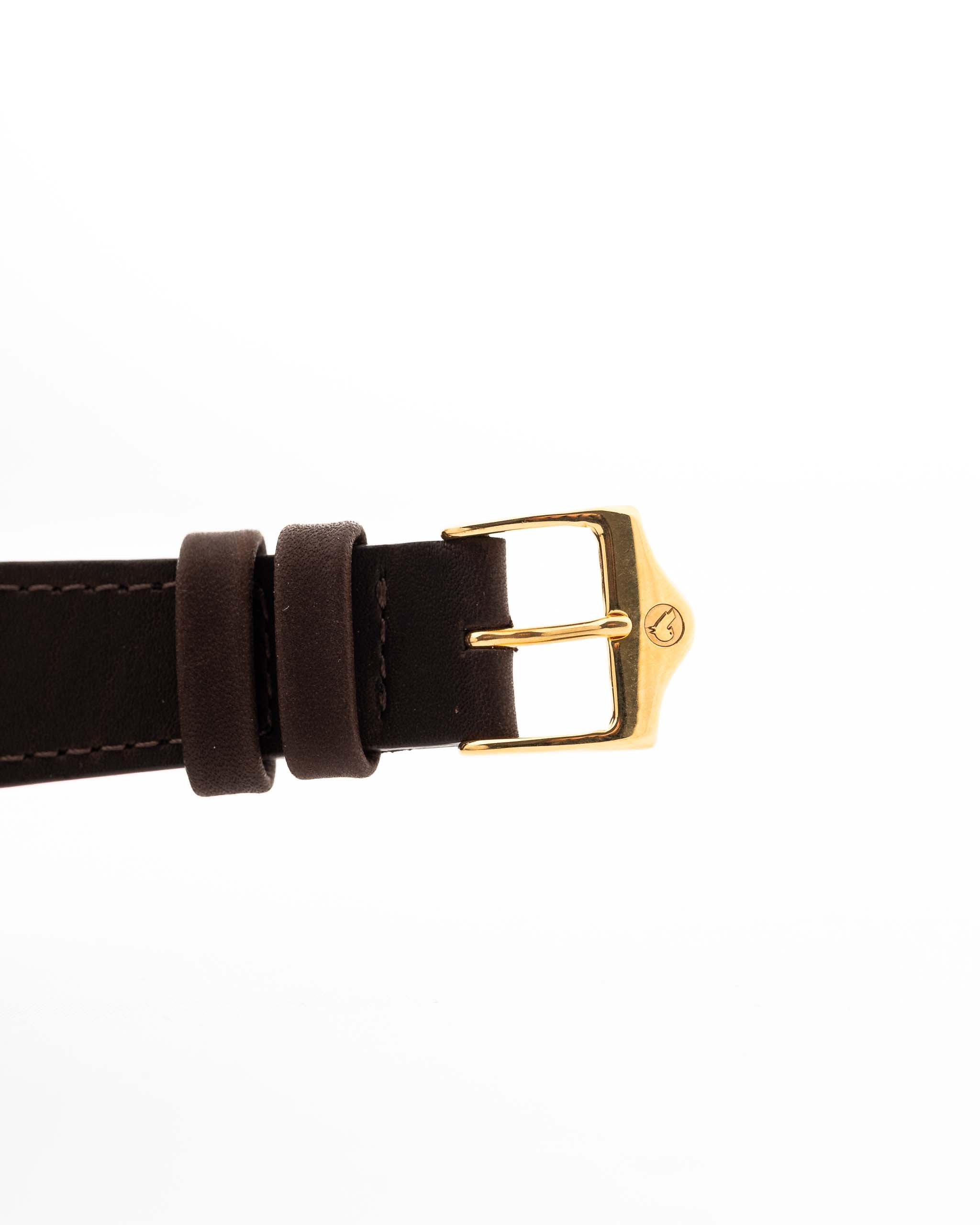 Closeup Photo of a Rolex Datejust 1601 Tiger Eye from 1974. 36mm with 18K yellow gold case, Tiger Eye stone dial, Automatic movement and Leather strap.