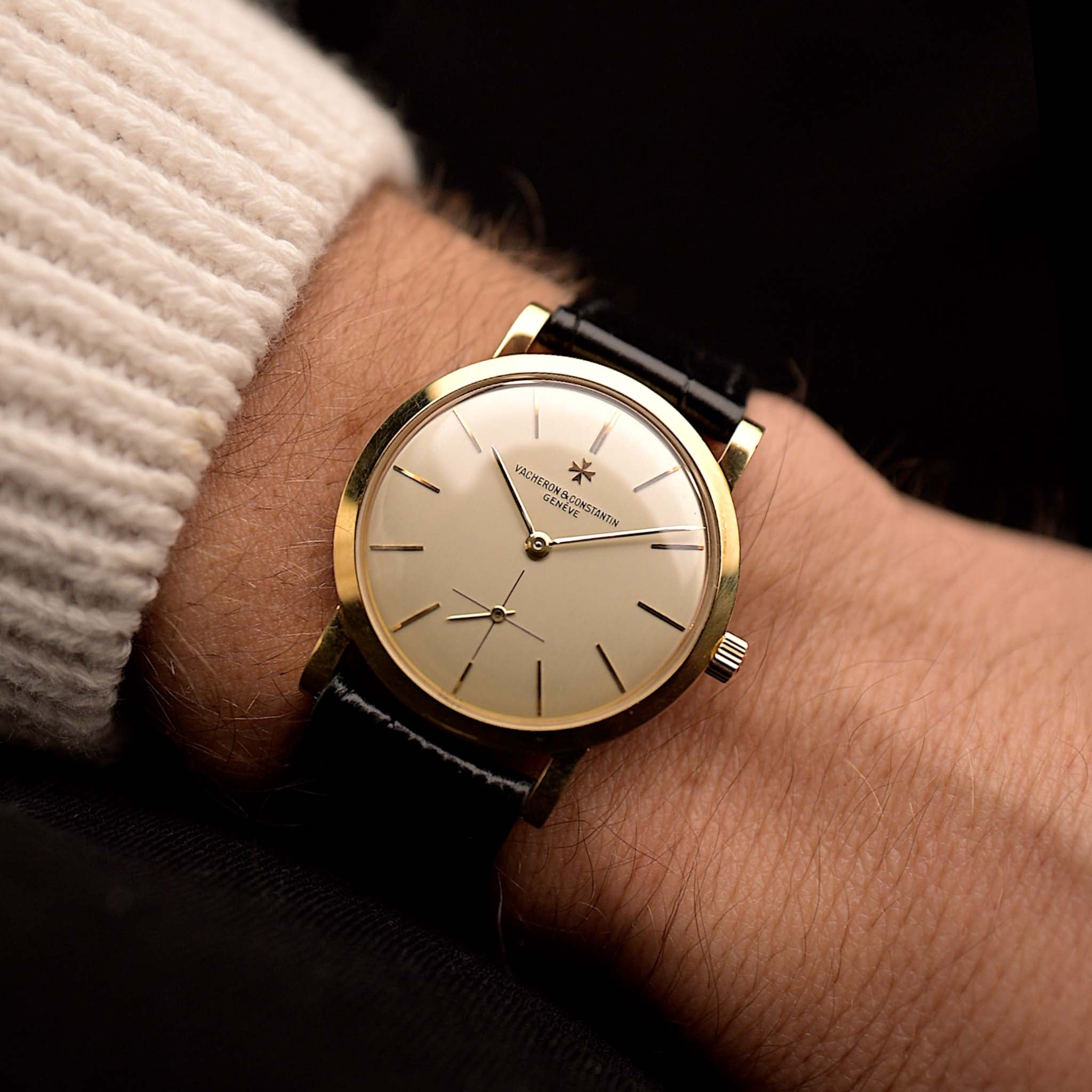 Vintage Vacheron Constantin 4667 Patrimony watch from 1956, 32mm 18k rose gold case, silver dial, manual wind movement, black leather strap on wrist