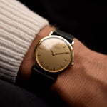 Patek Philippe 3520 Calatrava Ref. 3520 from the 1960s. 32mm in 18k Yellow Gold with Manual Wind Movement, Original Golden Brushed Dial and Leather Strap.