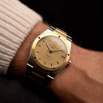 Vintage IWC Ingenieur 3505 SL Two Tone watch  from 1987 on a wrist. 34mm in Stainless Steel & 18k Yellow Gold with Automatic Movement, Golden Papergraph Dial and Two Tone Bracelet.