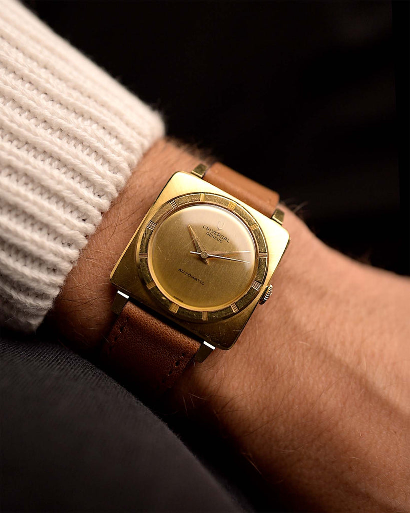 Vintage Universal Genéve 135102 watch  Cioccolatone 18k from the 1960s on a wrist. 30mm with 18k Yellow Gold case, Automatic movement, Original golden dial and Cognac brown Leather strap.