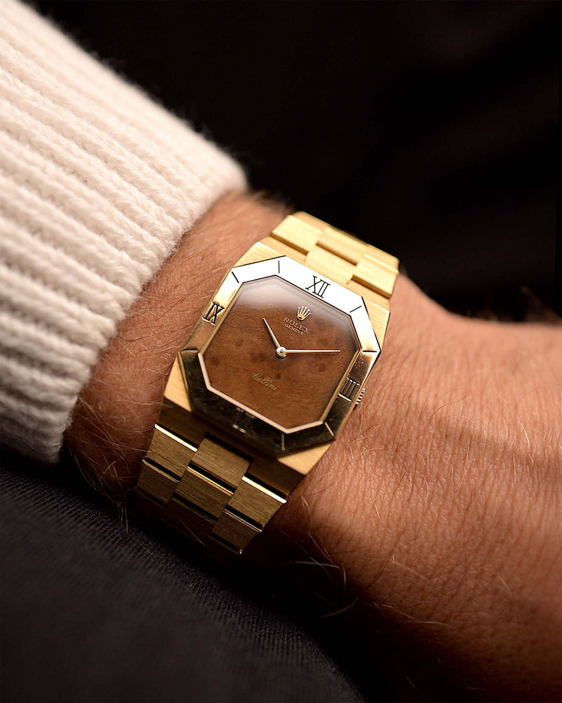 Vintage Rolex Cellini 4350 Watch Octagon Wood from 1981 on a wrist. 27mm in 18k Yellow Gold Case with Flawless Burl Wood Dial, Manual Wind Caliber 1601, Original 18k Rolex President Bracelet.