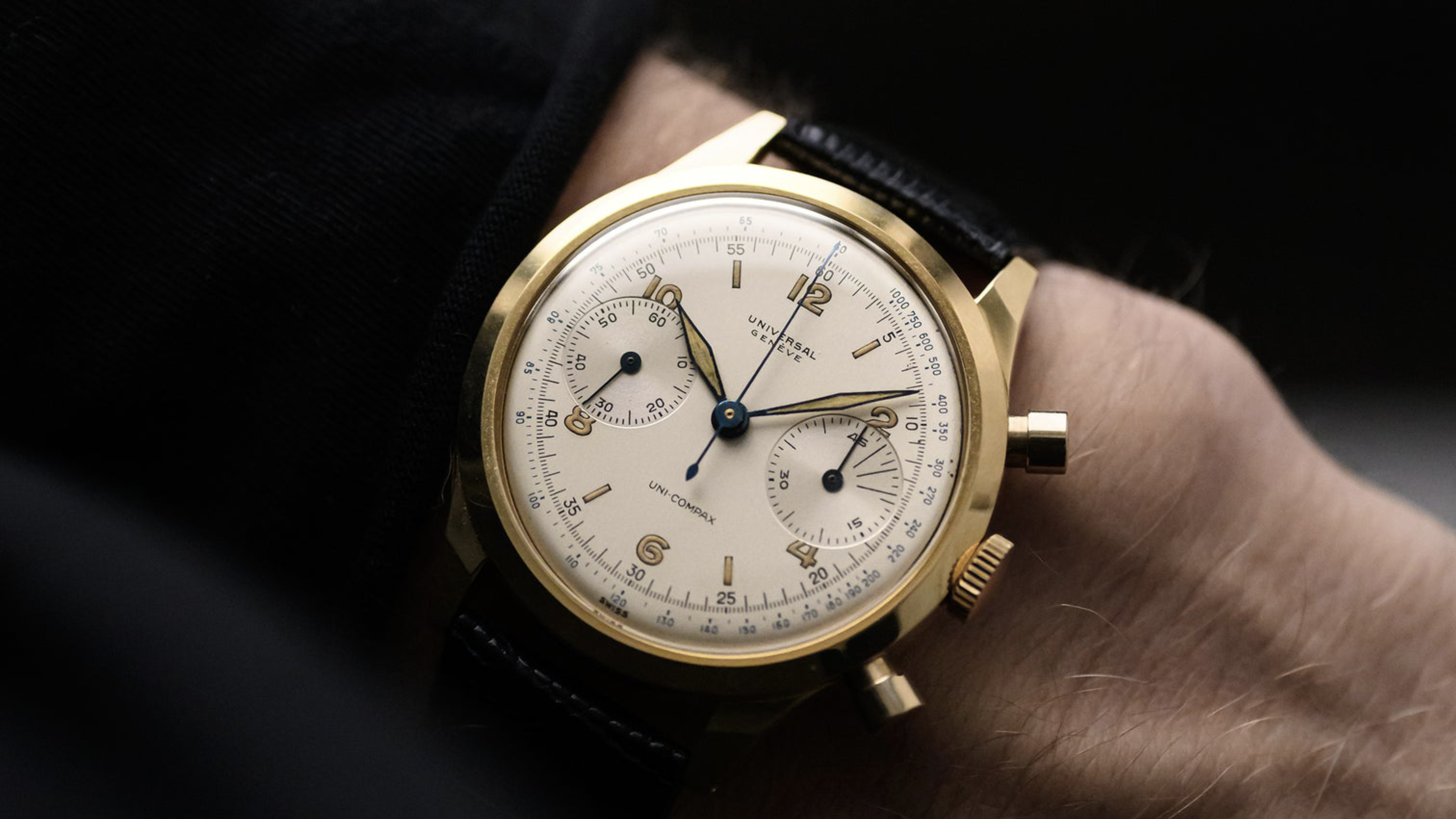 Wrist shot of a vintage 1940s Universal Geneve Uni-Compax chronograph with a yellow gold Spillmann case