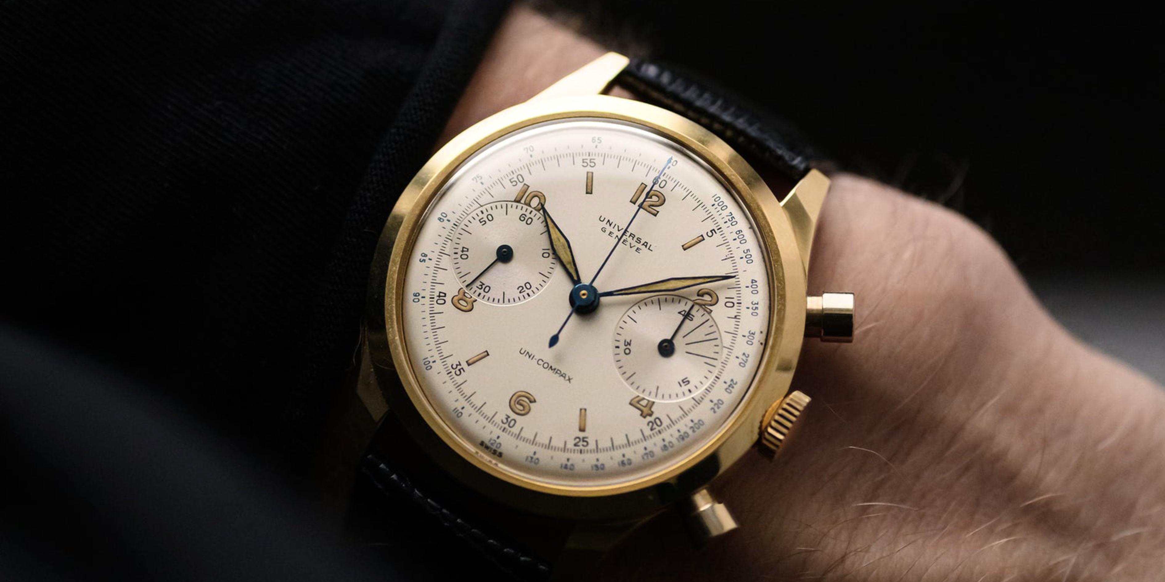 Wrist shot of a vintage 1940s Universal Geneve Uni-Compax chronograph with a yellow gold Spillmann case