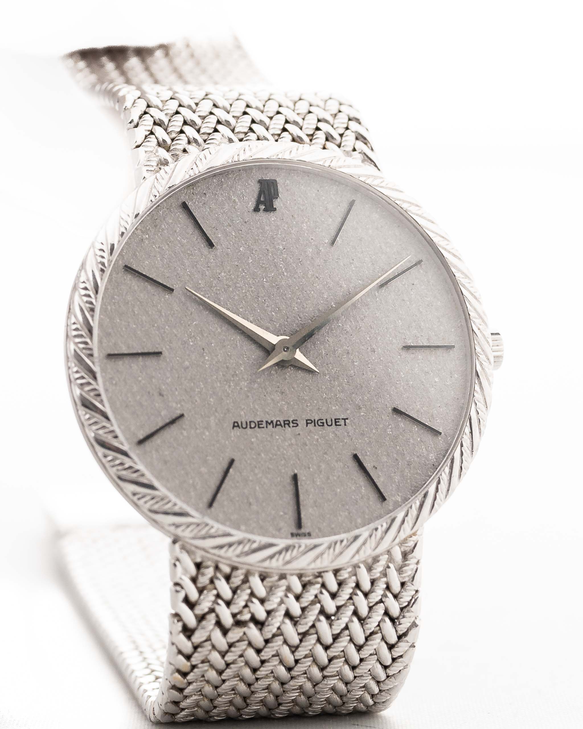 Audemars Piguet 18k Calatrava with a 34mm 18k white gold case, reflective silver dial, and white gold bracelet closeup