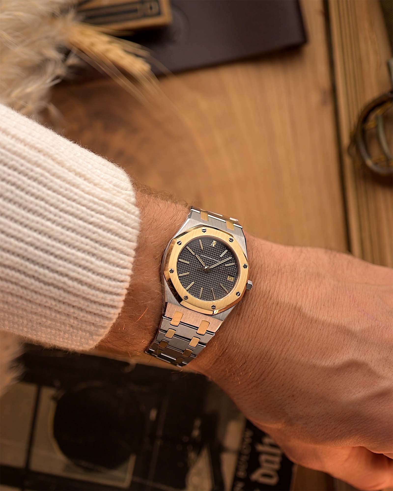 Vintage Audemars Piguet 4100SA Royal Oak Watch from the 1980s on a wrist. 36mm in Stainless Steel & 18k Yellow Gold with Rare flawless grey tapisserie dial, Two-Tone bracelet and Automatic movement.