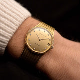 Vintage Audemars Piguet Automatic watch from the 1980s, 31.5mm 18k yellow gold case, gold dial, 11 diamond hour markers on wrist