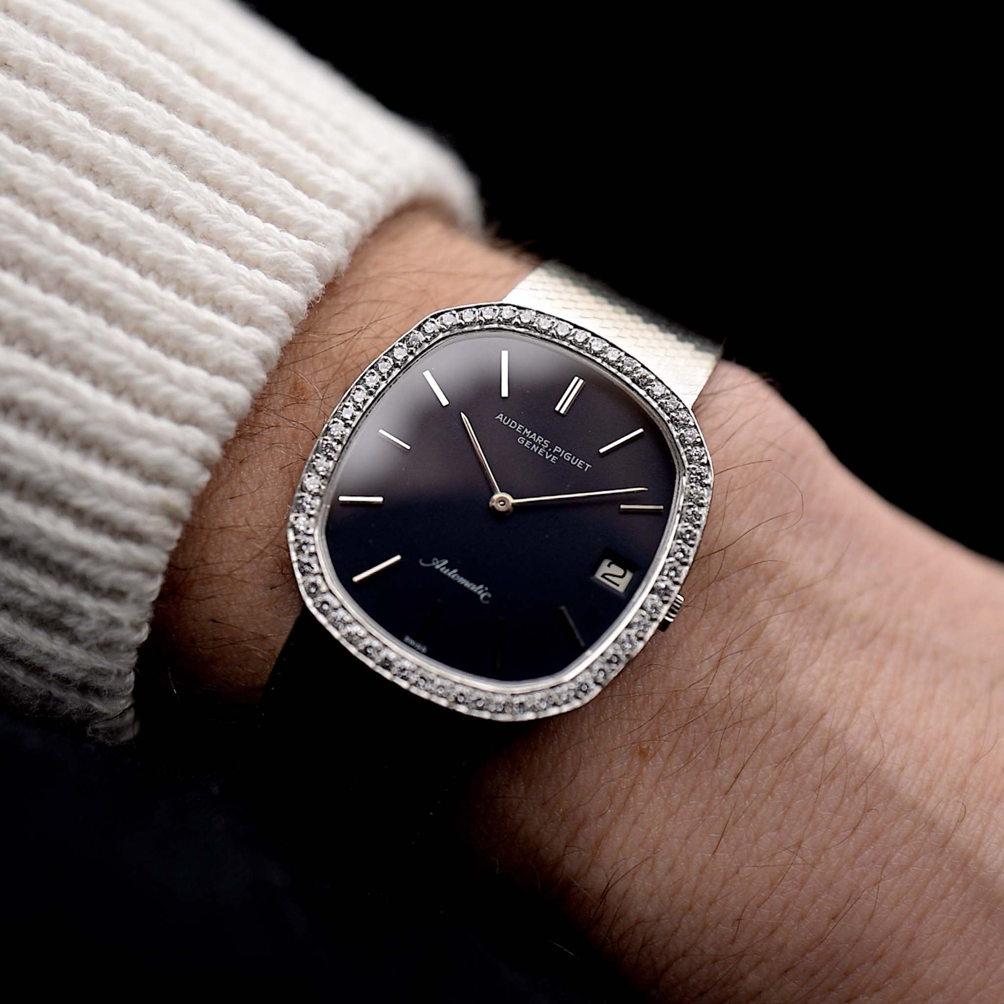Photo of a vintage Audemars Piguet Ellipse 18k Diamond Black from the 1970s on a wrist. 33mm case in 18k White Gold with Automatic Cal. 2121, Flawless Original Black Dial, 60 Diamonds and Adjustable Bracelet.