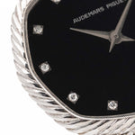 Closeup Photo of a Audemars Piguet Octagon Black Diamond from the 1970s on a wrist. 31.5mm case in 18k White Gold with Manual Wind Caliber 2003, Black Dial with Diamond Markers ad Adjustable 18k Bracelet.