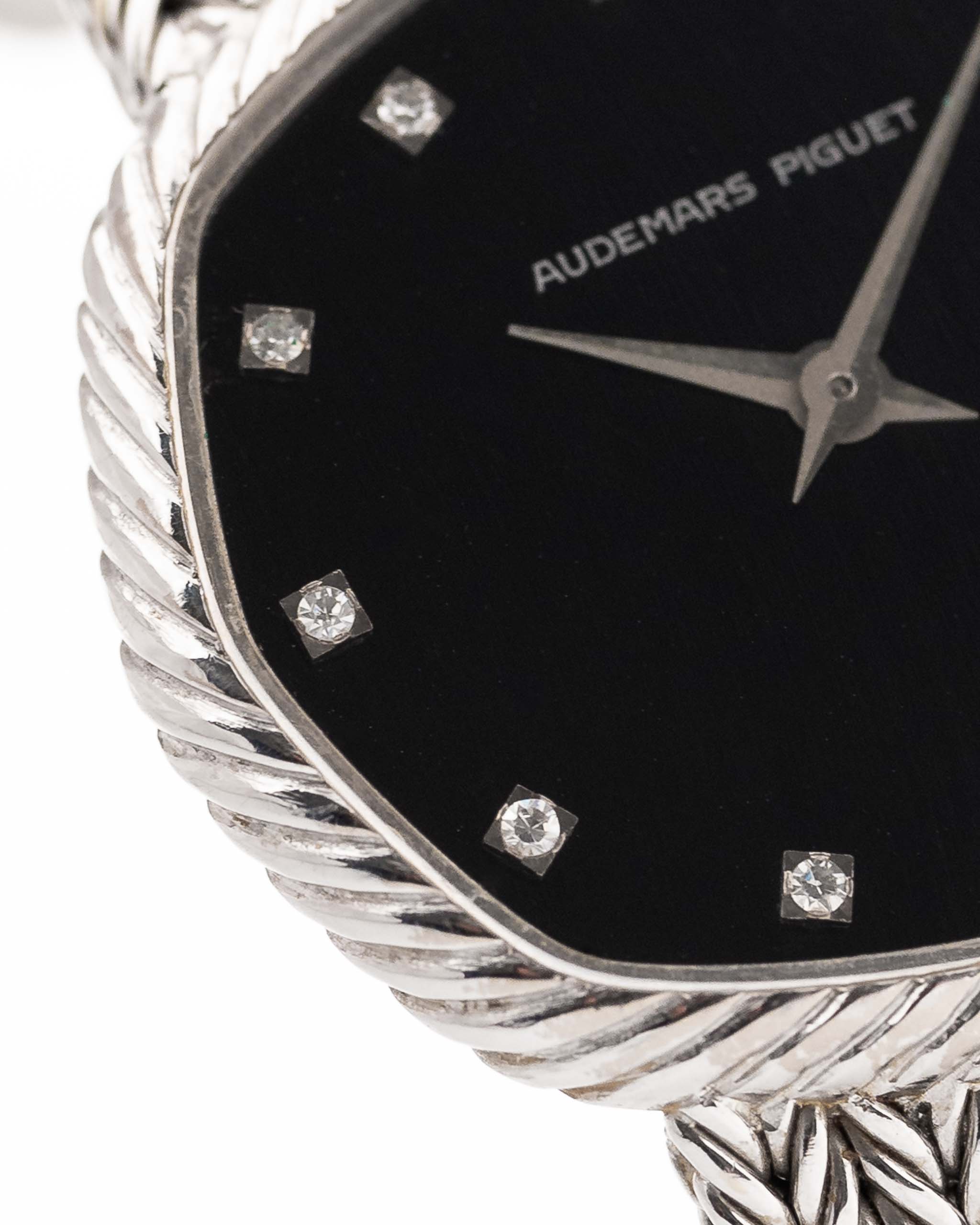 Closeup Photo of a Audemars Piguet Octagon Black Diamond from the 1970s on a wrist. 31.5mm case in 18k White Gold with Manual Wind Caliber 2003, Black Dial with Diamond Markers ad Adjustable 18k Bracelet.