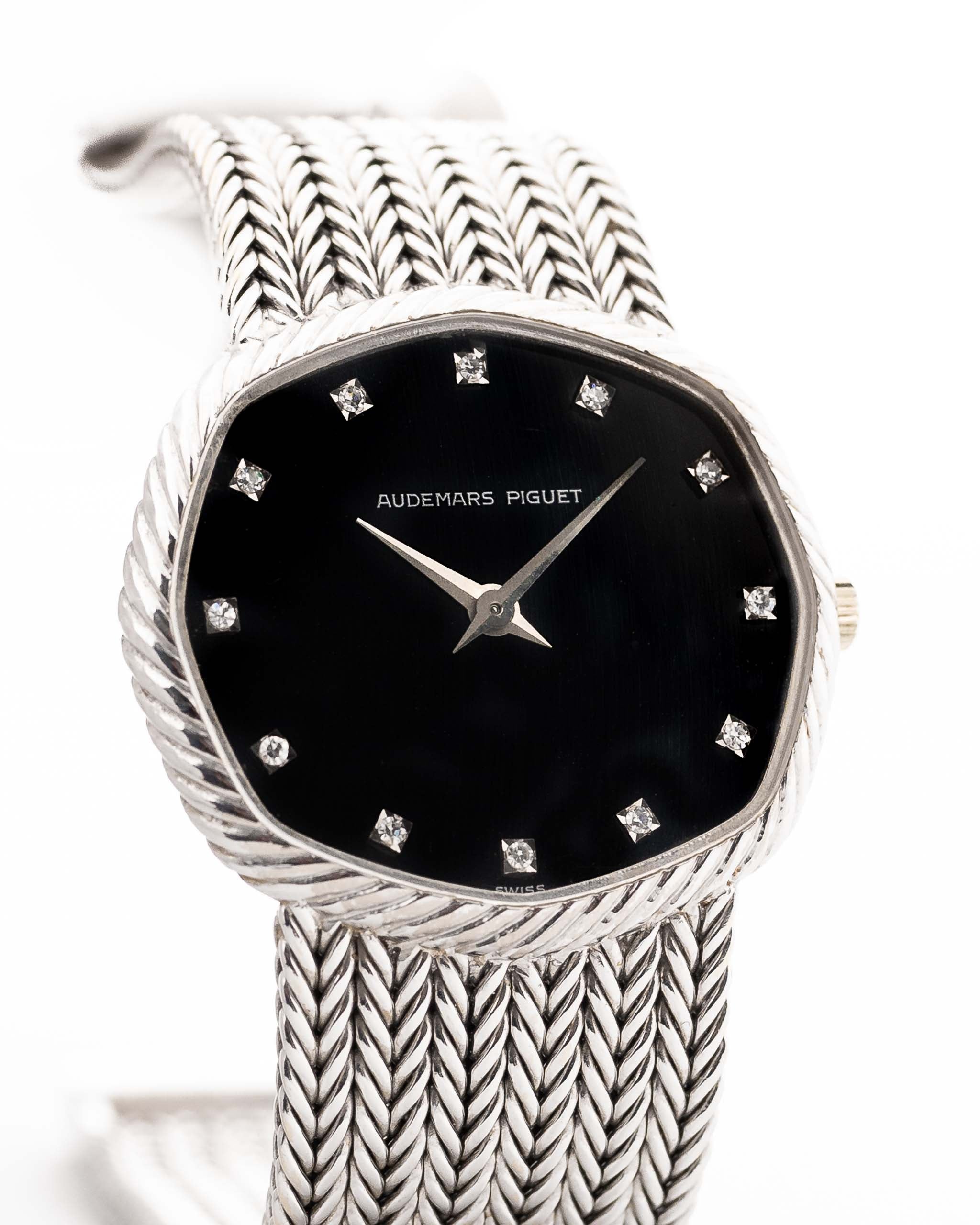 Closeup Photo of a Audemars Piguet Octagon Black Diamond from the 1970s on a wrist. 31.5mm case in 18k White Gold with Manual Wind Caliber 2003, Black Dial with Diamond Markers ad Adjustable 18k Bracelet.