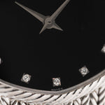 Closeup Photo of a Audemars Piguet Octagon Black Diamond from the 1970s on a wrist. 31.5mm case in 18k White Gold with Manual Wind Caliber 2003, Black Dial with Diamond Markers ad Adjustable 18k Bracelet.