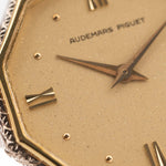 Closeup Photo of a Audemars Piguet Octagon Two Tone 18k from the 1980s. 30mm with 18k Yellow Gold Case, Golden Aventurine Dial, Manual Wind Movement and Yellow Gold Bracelet.